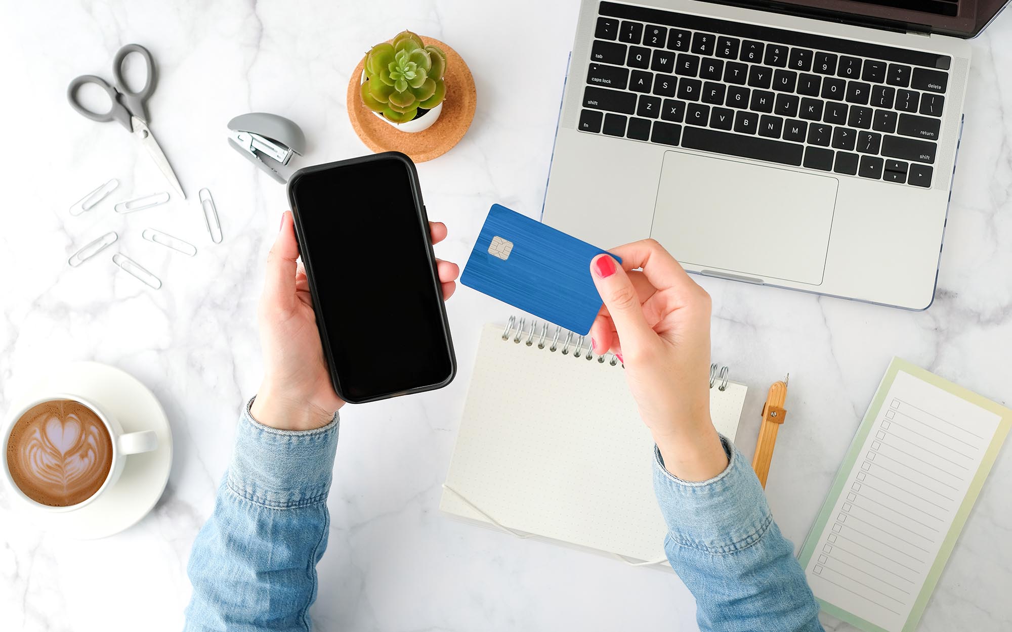 Consumer using credit card to make purchase on phone